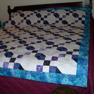 Annette makes a quilt top for her church women's group to quilt and raffle.  This is the quilt from 2004.